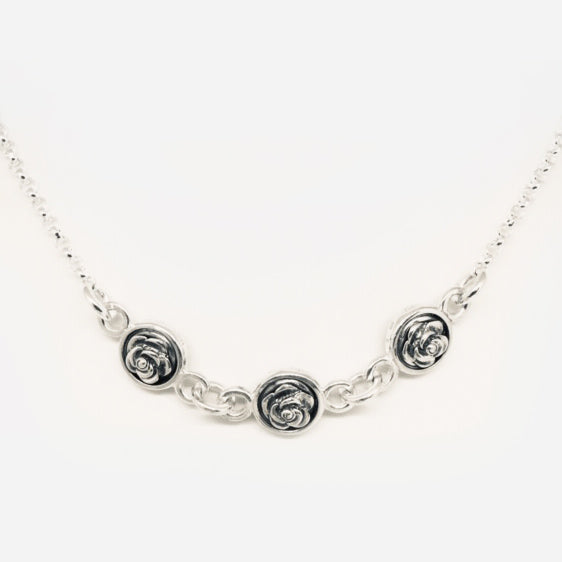 Triple, double sided oxidised roses in a row necklace